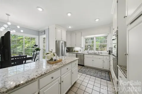 a kitchen with refrigerator and window