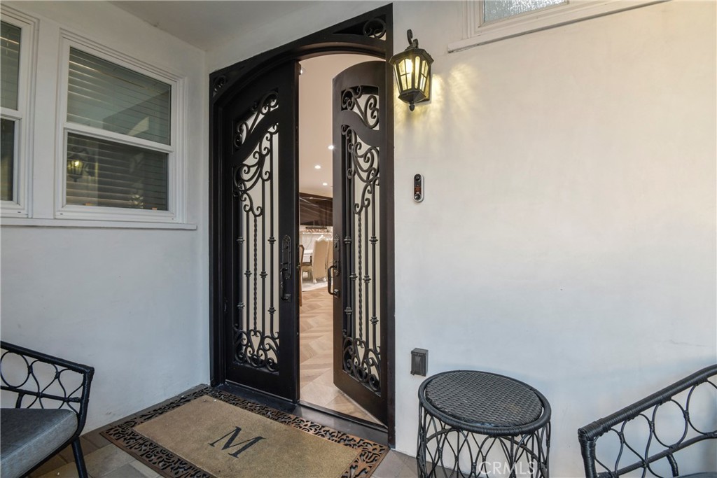 9728 Rhea Avenue Northridge, CA 91324 - Photo 6 of 36 a view of entryway with a front door and wooden floor