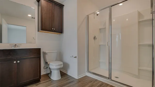 a view of a small space with a window and a fan