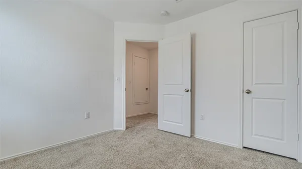 a bathroom with a granite countertop sink a mirror and shower