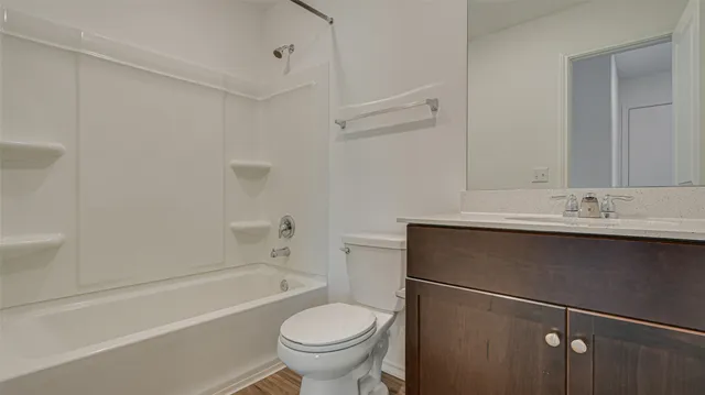 a view of an empty room and a window