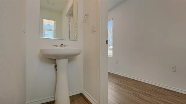 a view of kitchen with microwave oven stove and oven