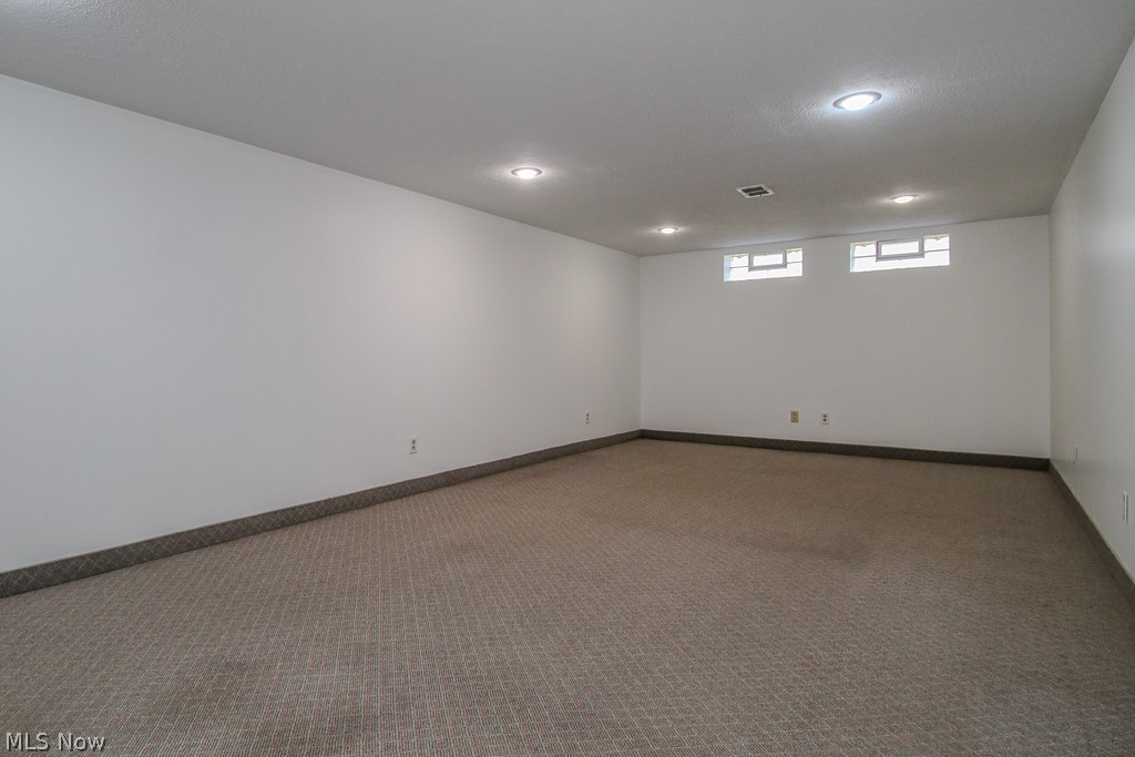 30224 Regent Road Wickliffe, OH 44092 - Photo 18 of 27 Carpeted empty room featuring baseboards and recessed lighting
