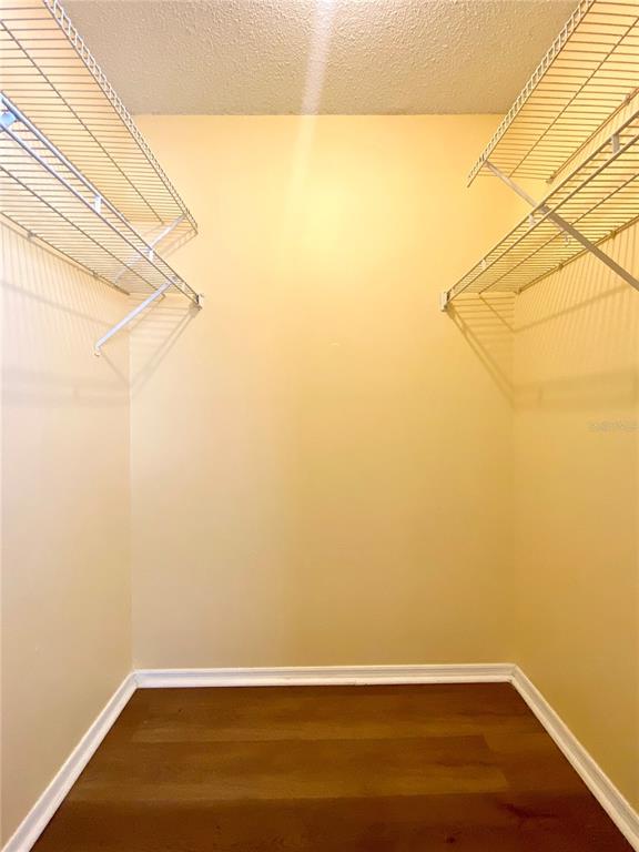 64 Windtree Lane, Unit 203 Winter Garden, FL 34787 - Photo 11 of 13 a view of a room with wooden floor