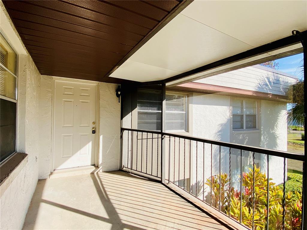 64 Windtree Lane, Unit 203 Winter Garden, FL 34787 - Photo 3 of 13 a view of balcony with wooden floor