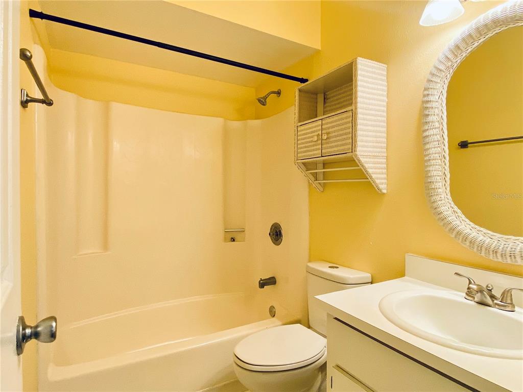 64 Windtree Lane, Unit 203 Winter Garden, FL 34787 - Photo 7 of 13 a bathroom with a sink and a mirror
