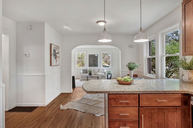 a kitchen with sink and refrigerator