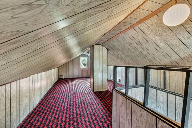 a view of balcony with wooden floor