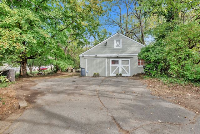 a view of a house with a street