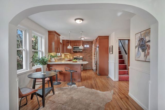 a room with a table and chairs in it