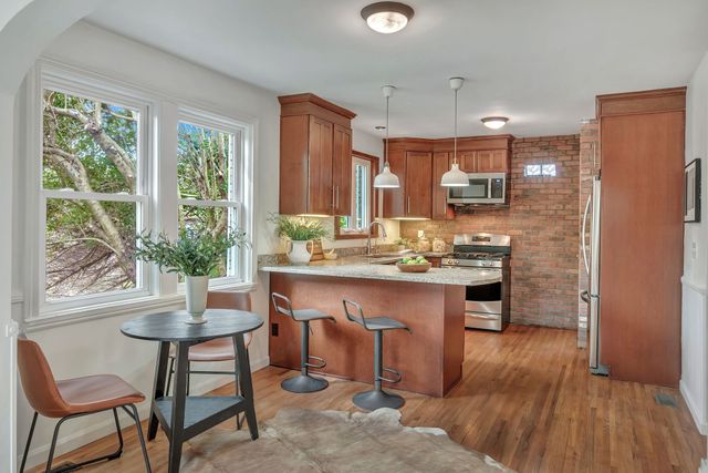 a kitchen with a table and chairs in it