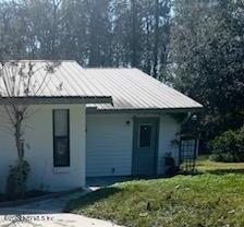 1355-1 Blackmon Road Green Cove Springs, FL 32043 - Photo 1 of 14 a front view of a house with a garden