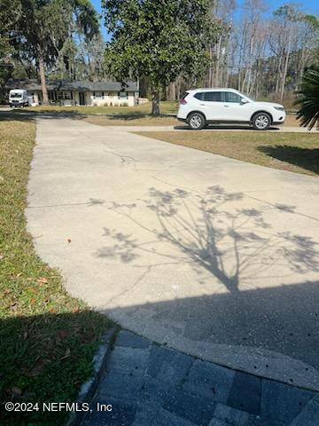 1355-1 Blackmon Road Green Cove Springs, FL 32043 - Photo 13 of 14 a car parked on the side of the road next to a road
