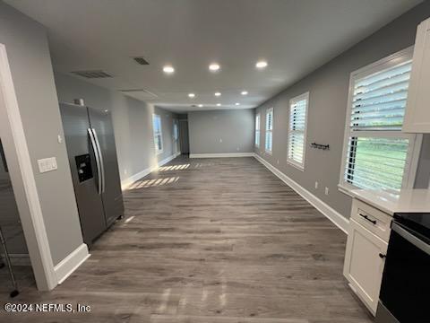 1355-1 Blackmon Road Green Cove Springs, FL 32043 - Photo 3 of 14 a view of a hallway with wooden floor and staircase