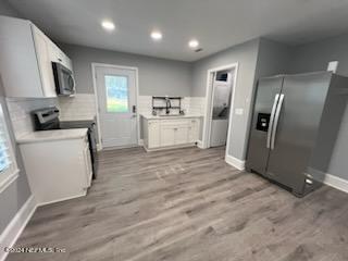 1355-1 Blackmon Road Green Cove Springs, FL 32043 - Photo 7 of 14 a kitchen with stainless steel appliances a refrigerator sink and microwave