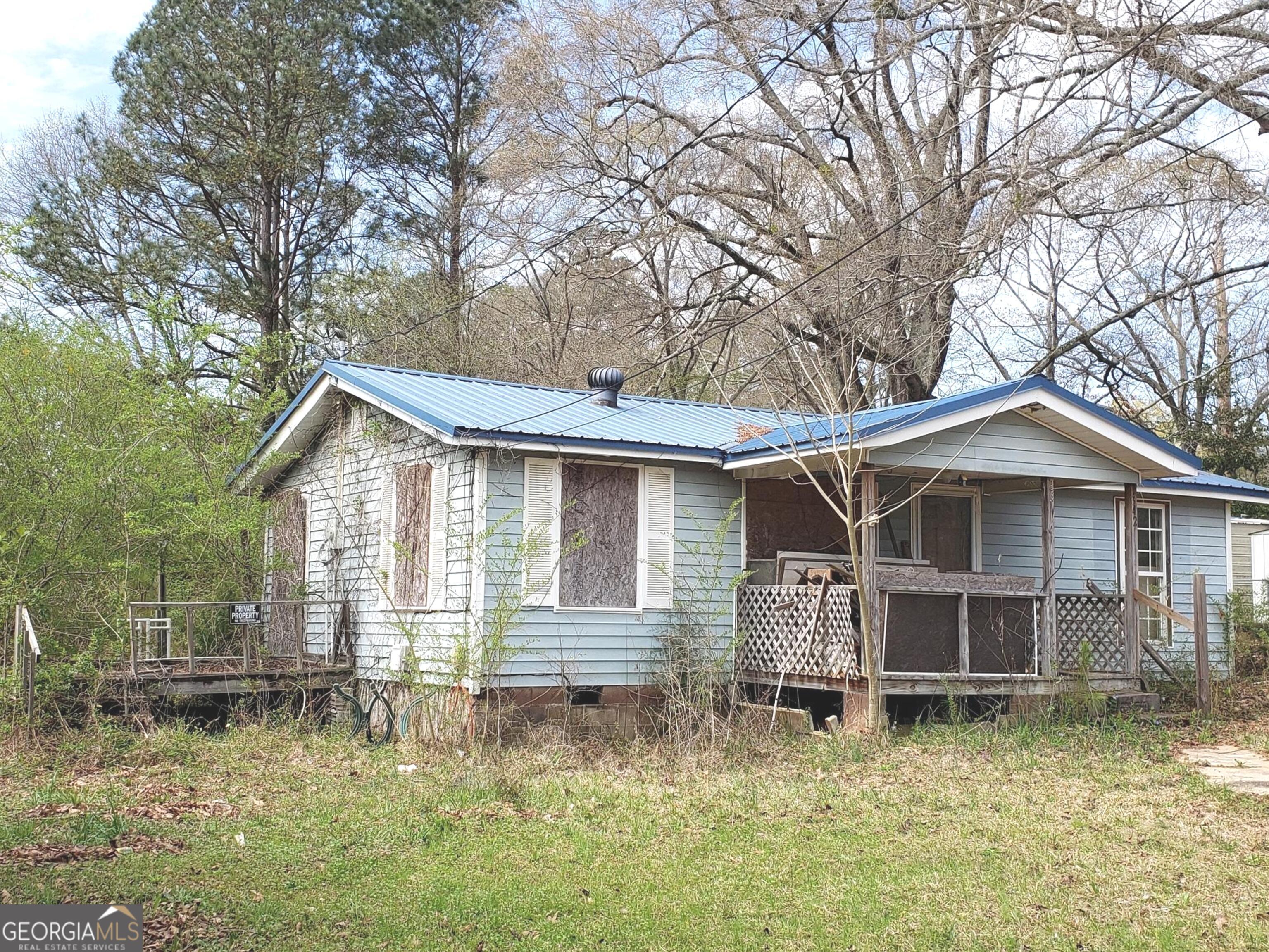 342 Hines Road LaGrange, GA 30241 - Photo 1 of 1 a view of a house with a yard and large tree