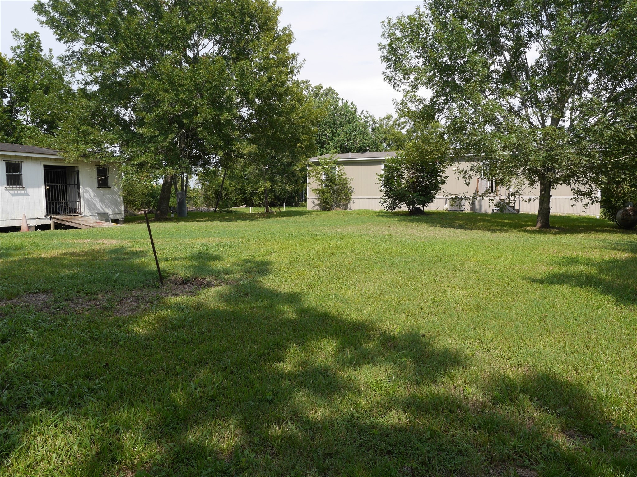 16020 1/2 Sam Brookins Street Sugar Land, TX 77498 - Photo 20 of 23 a view of a house with backyard