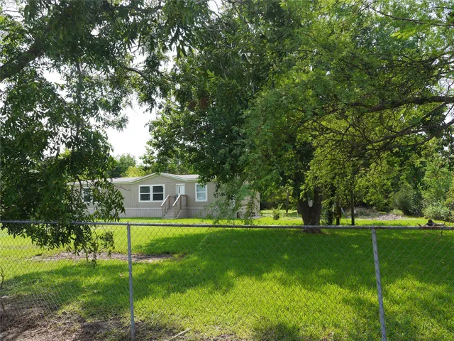 a house view with a sitting space and garden view