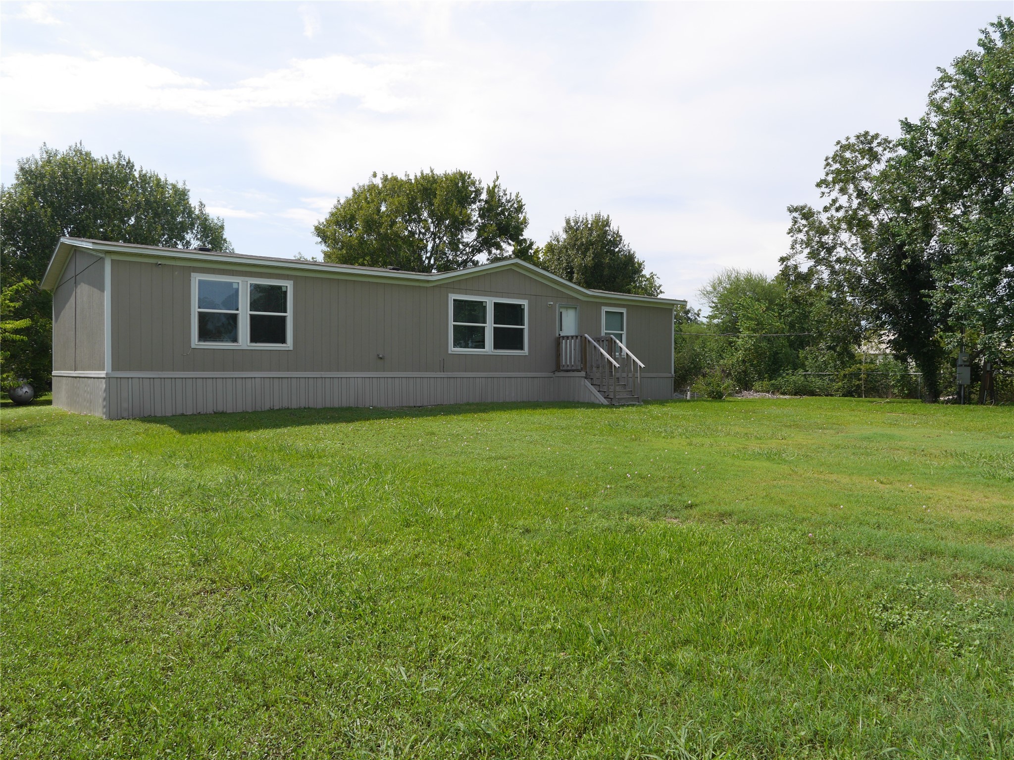 16020 1/2 Sam Brookins Street Sugar Land, TX 77498 - Photo 8 of 23 a view of a backyard of the house