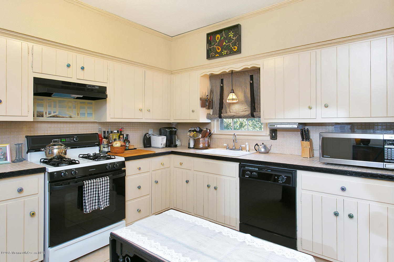 704 Schoolhouse Road Brielle, NJ 08730 - Photo 14 of 20 a kitchen with stainless steel appliances granite countertop a sink stove and cabinets