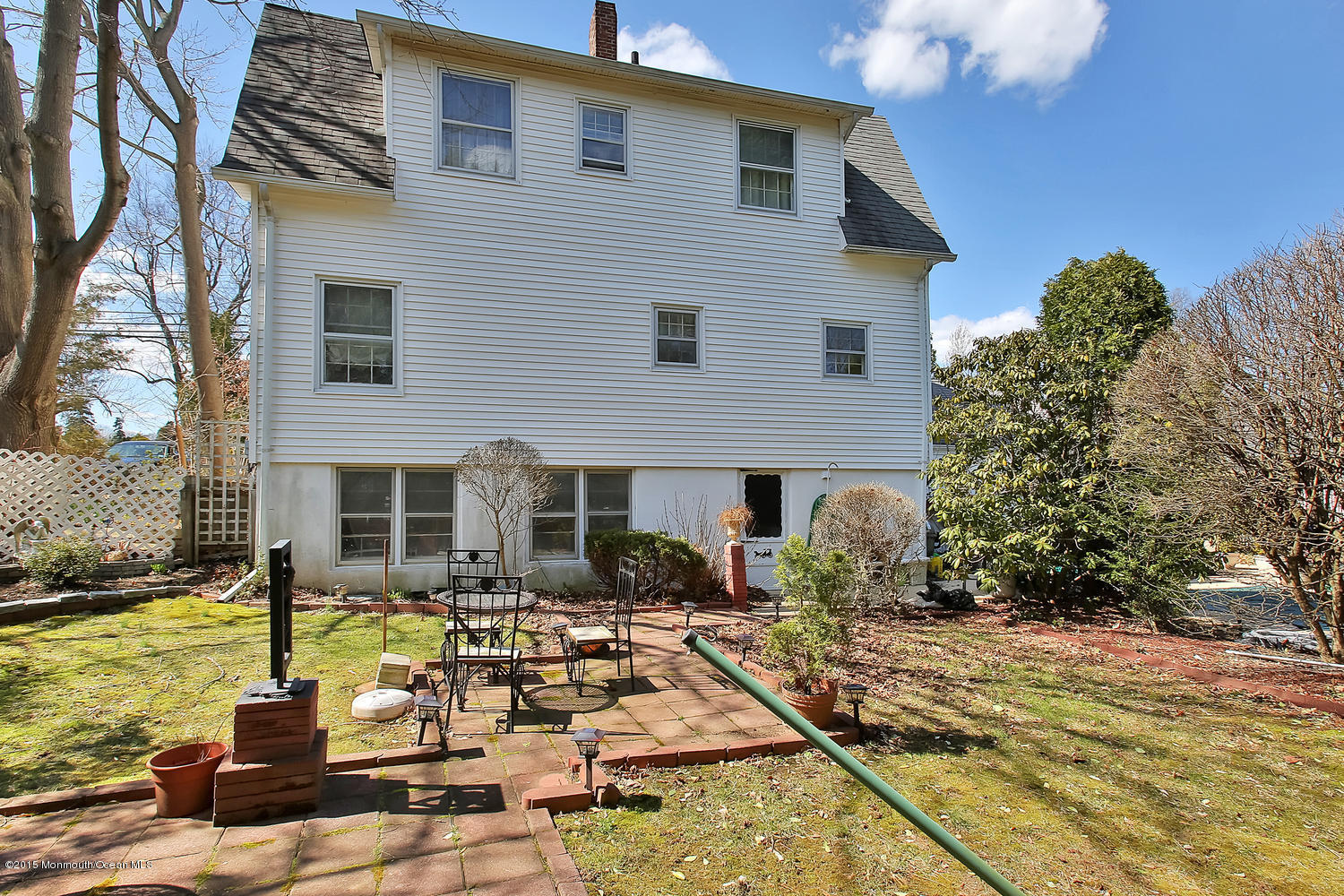 704 Schoolhouse Road Brielle, NJ 08730 - Photo 20 of 20 a front view of a house with garden