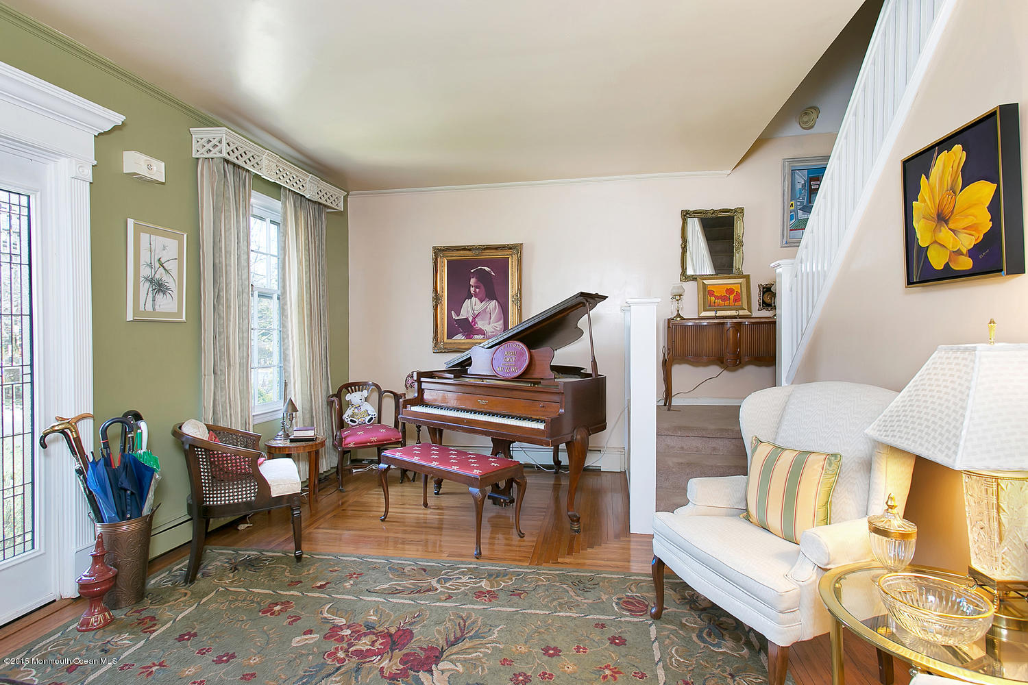 704 Schoolhouse Road Brielle, NJ 08730 - Photo 2 of 20 a living room with furniture a rug and a piano