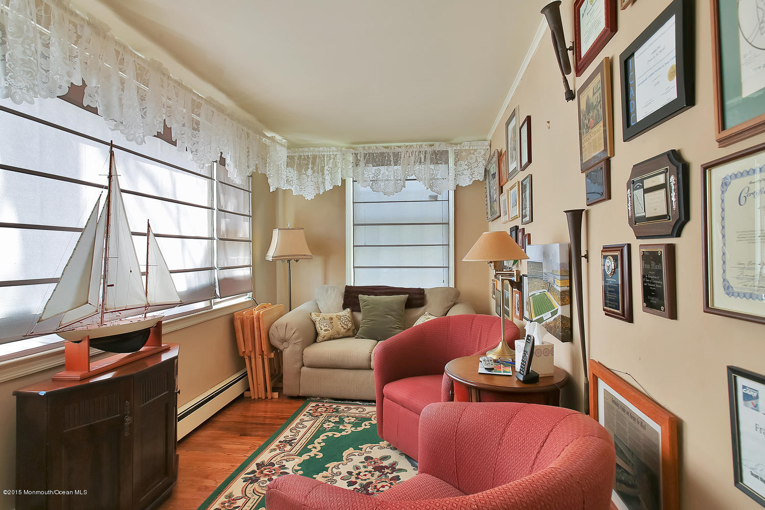704 Schoolhouse Road Brielle, NJ 08730 - Photo 8 of 20 a living room with furniture a couch and a window