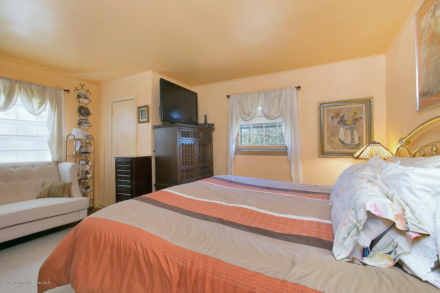 704 Schoolhouse Road Brielle, NJ 08730 - Photo 9 of 20 a bedroom with a bed and wooden floor