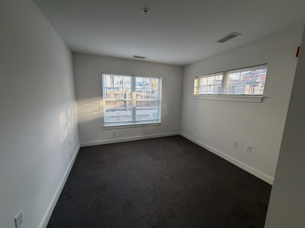 10 Myrtle Street, Unit 51B Waltham, MA 02453 - Photo 5 of 11 an empty room with a window