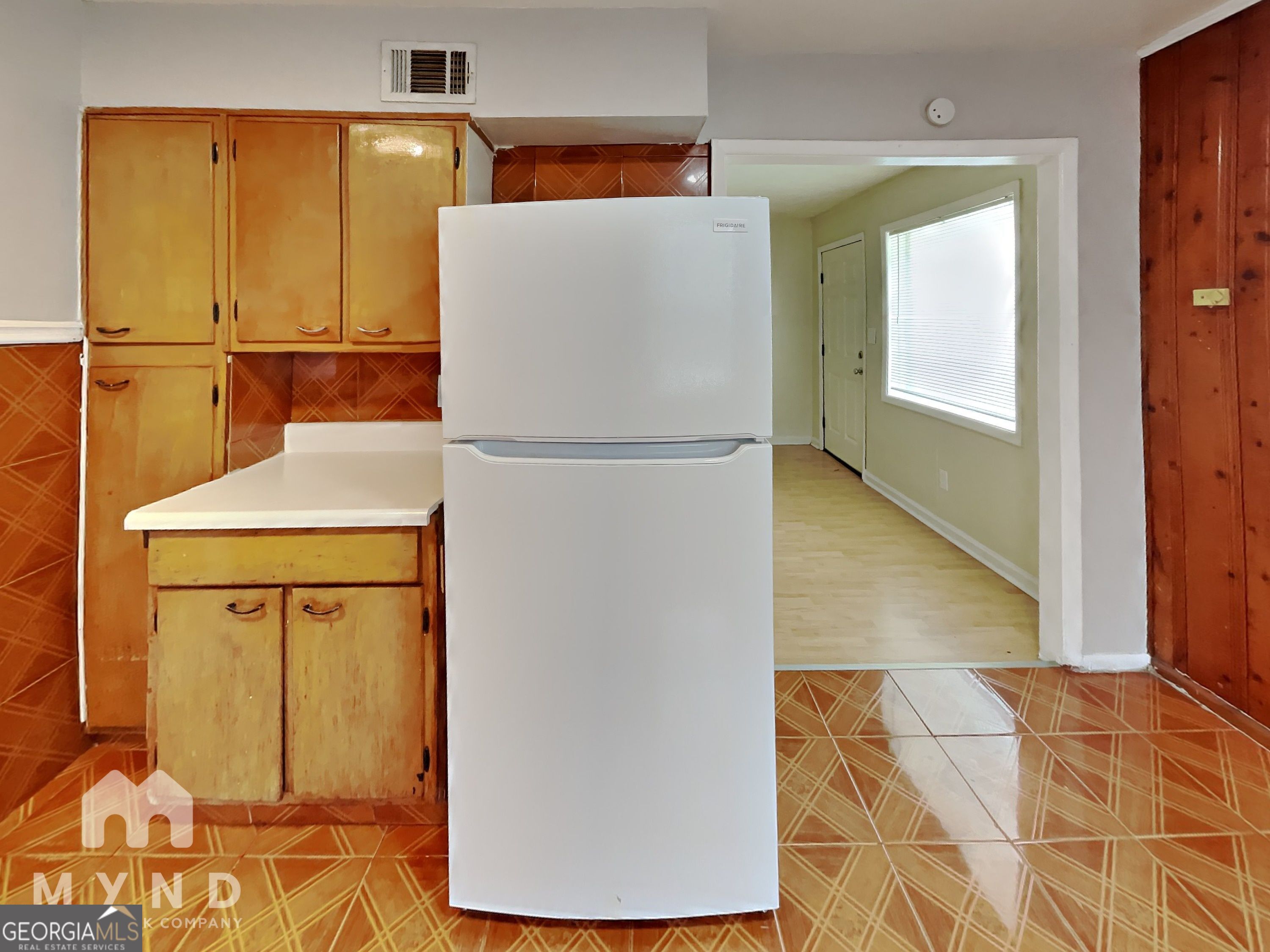 730 Hill Street Forest Park, GA 30297 - Photo 6 of 12 a white refrigerator freezer sitting in a kitchen