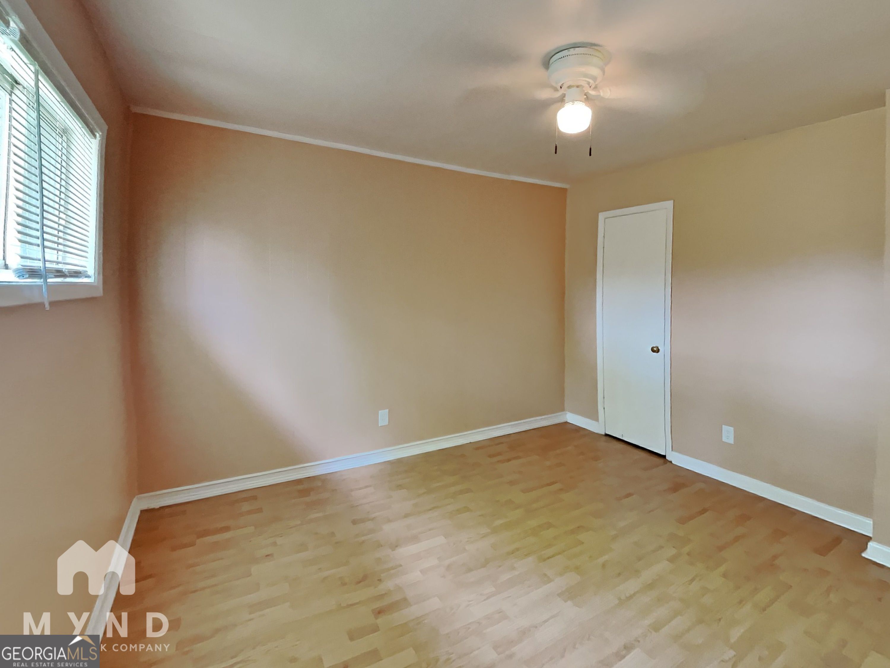 730 Hill Street Forest Park, GA 30297 - Photo 7 of 12 wooden floor in an empty room with a window