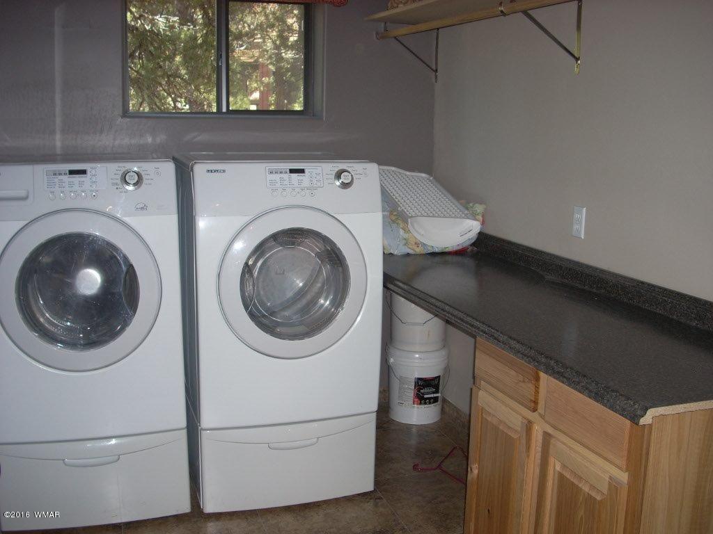 2975 East Lookout Lane Overgaard, AZ 85933 - Photo 14 of 34 a utility room with dryer and washer
