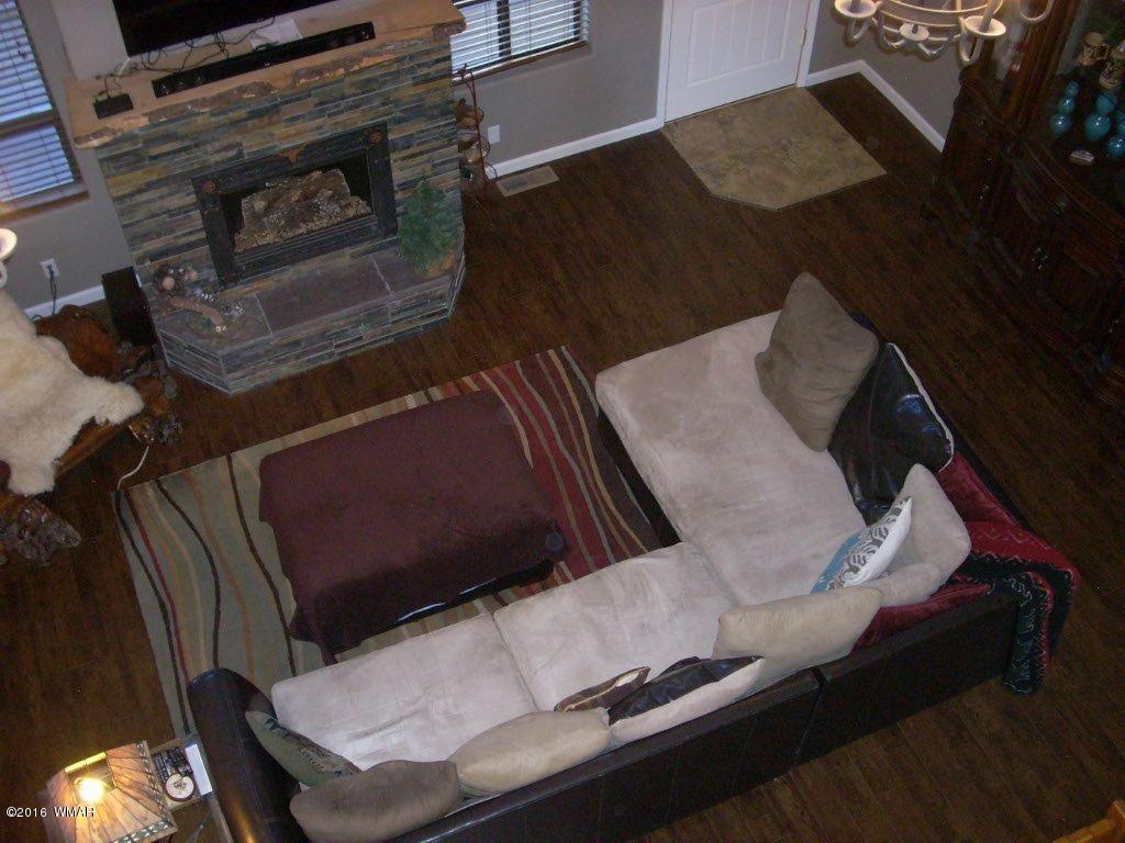 2975 East Lookout Lane Overgaard, AZ 85933 - Photo 28 of 34 a close up of a fireplace