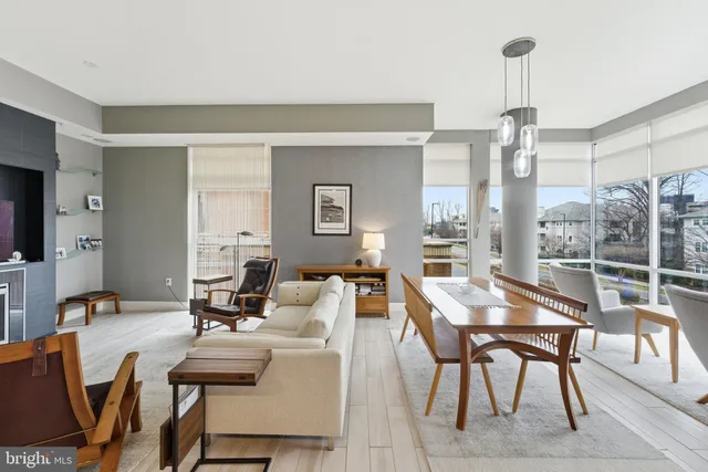 a living room with couches and a rug