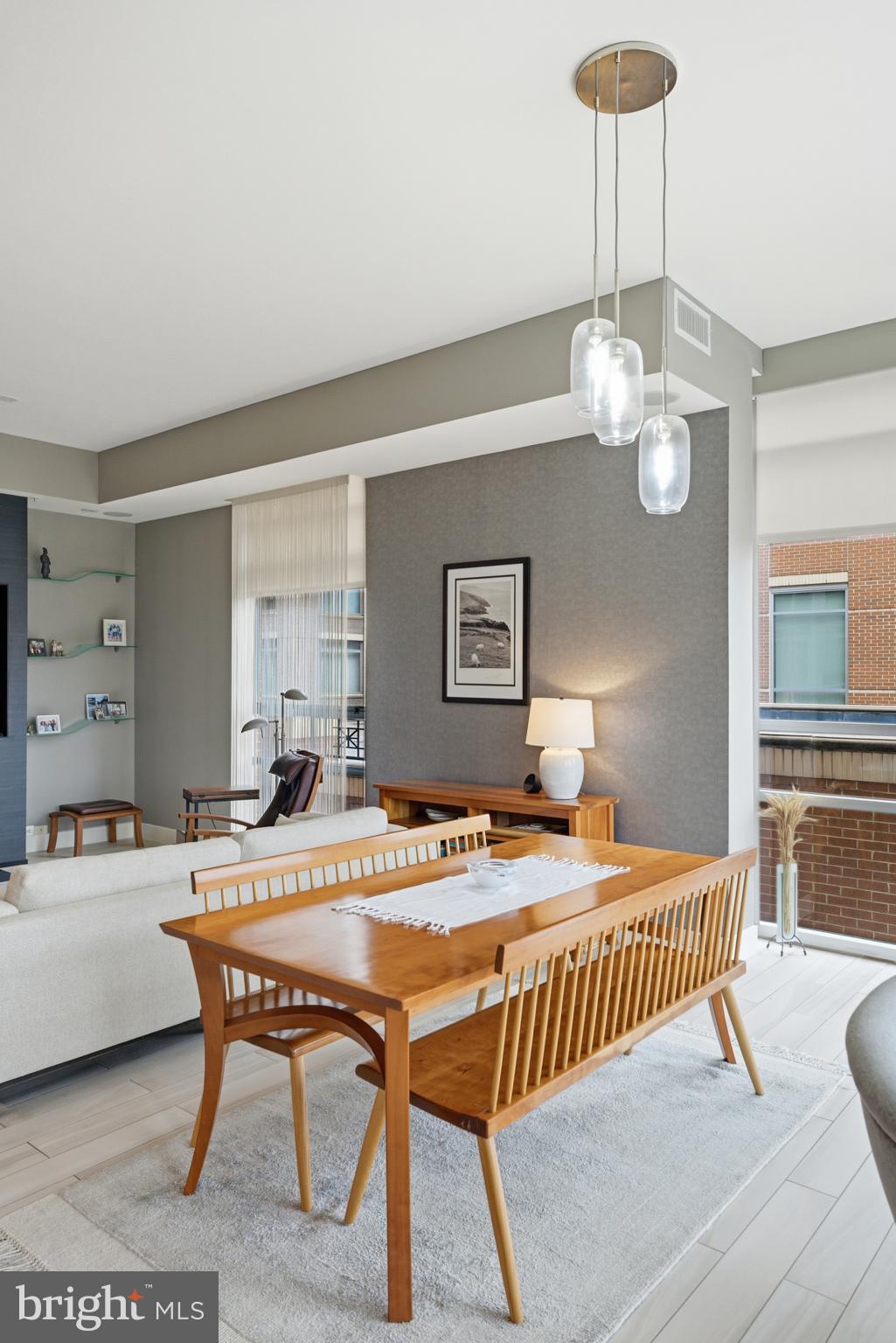 12025 New Dominion Parkway, Unit 103 Reston, VA 20190 - Photo 19 of 47 a dining room with a table and chairs