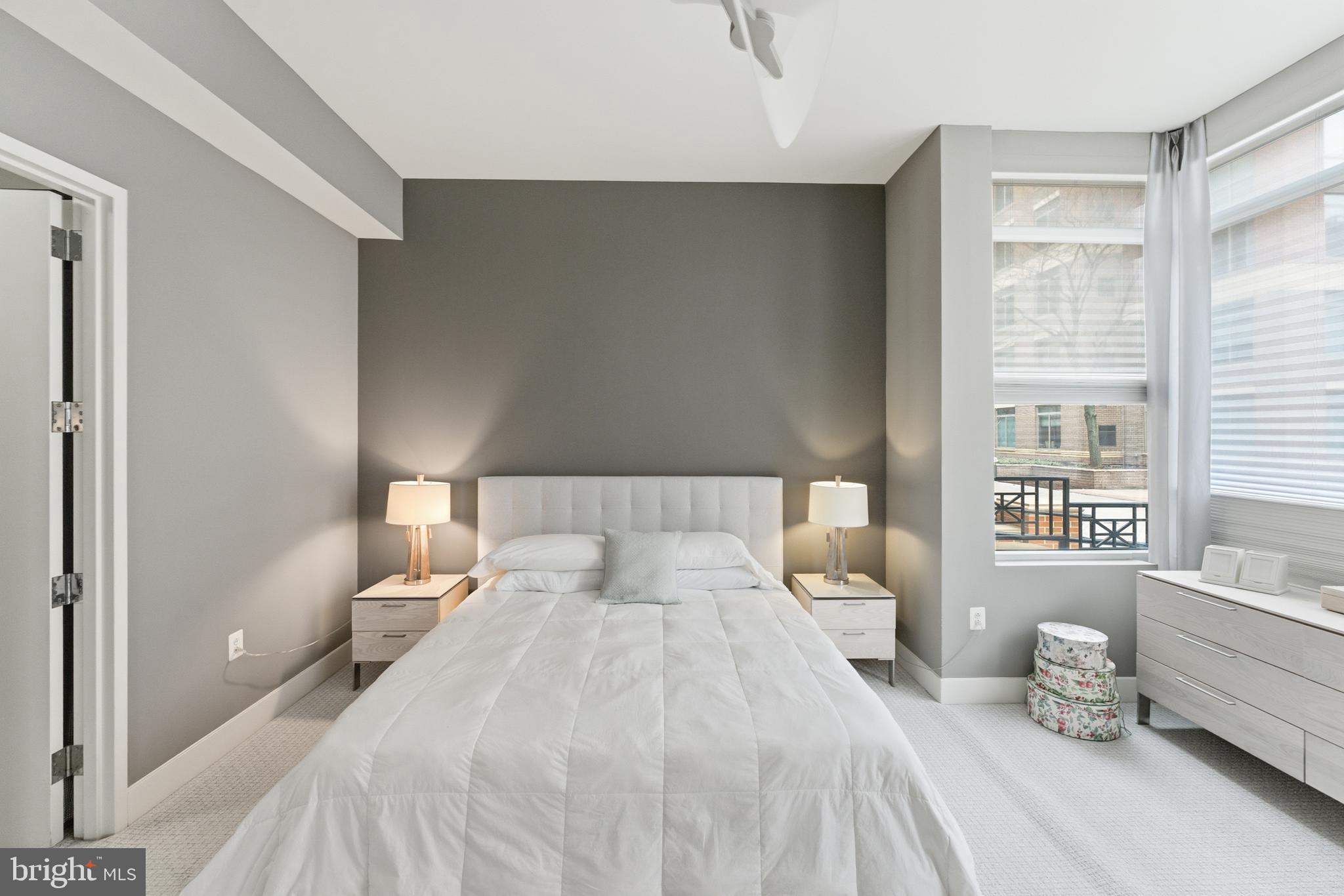 12025 New Dominion Parkway, Unit 103 Reston, VA 20190 - Photo 25 of 47 a bedroom with a bed and a window