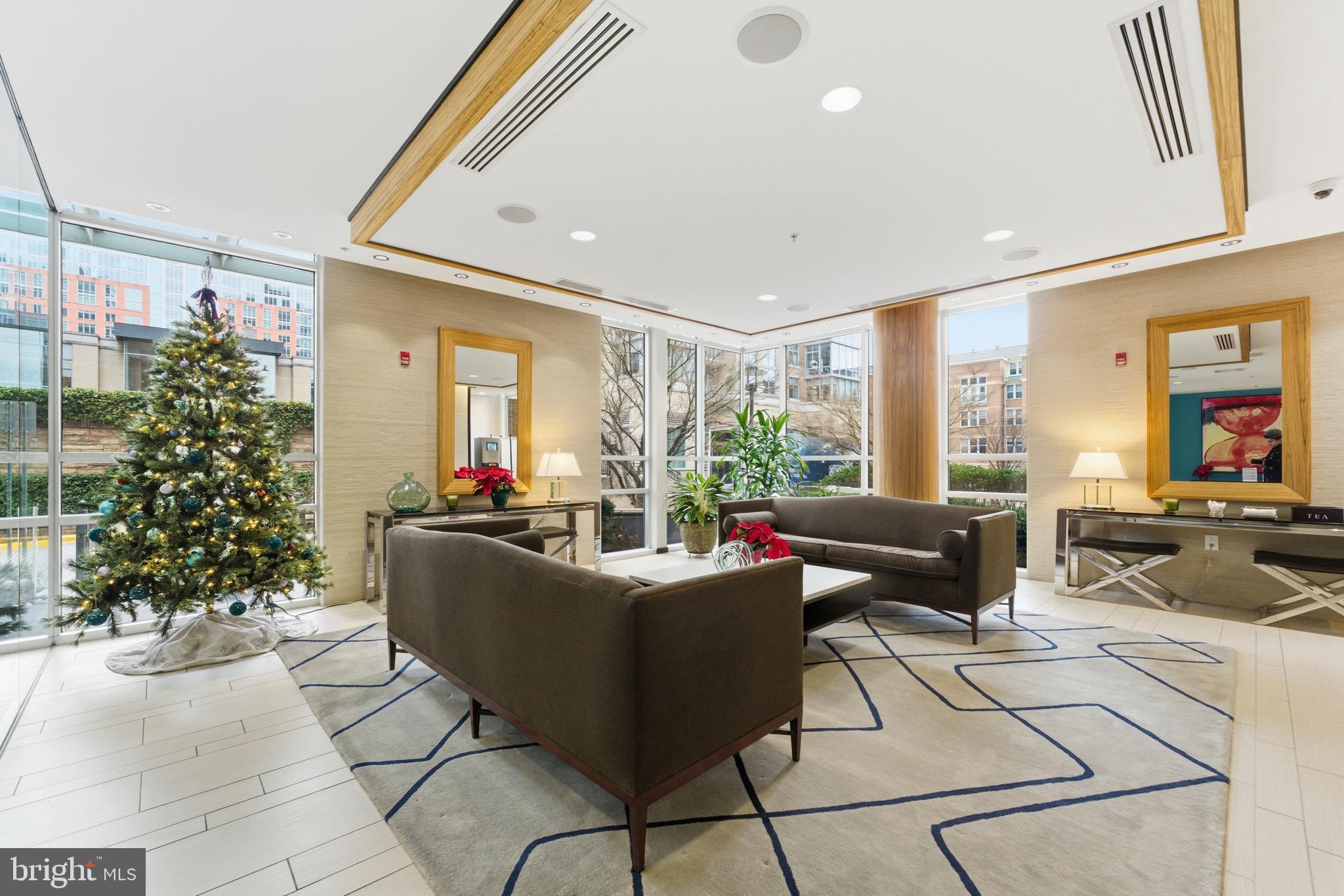 12025 New Dominion Parkway, Unit 103 Reston, VA 20190 - Photo 42 of 47 a living room with furniture and a potted plant