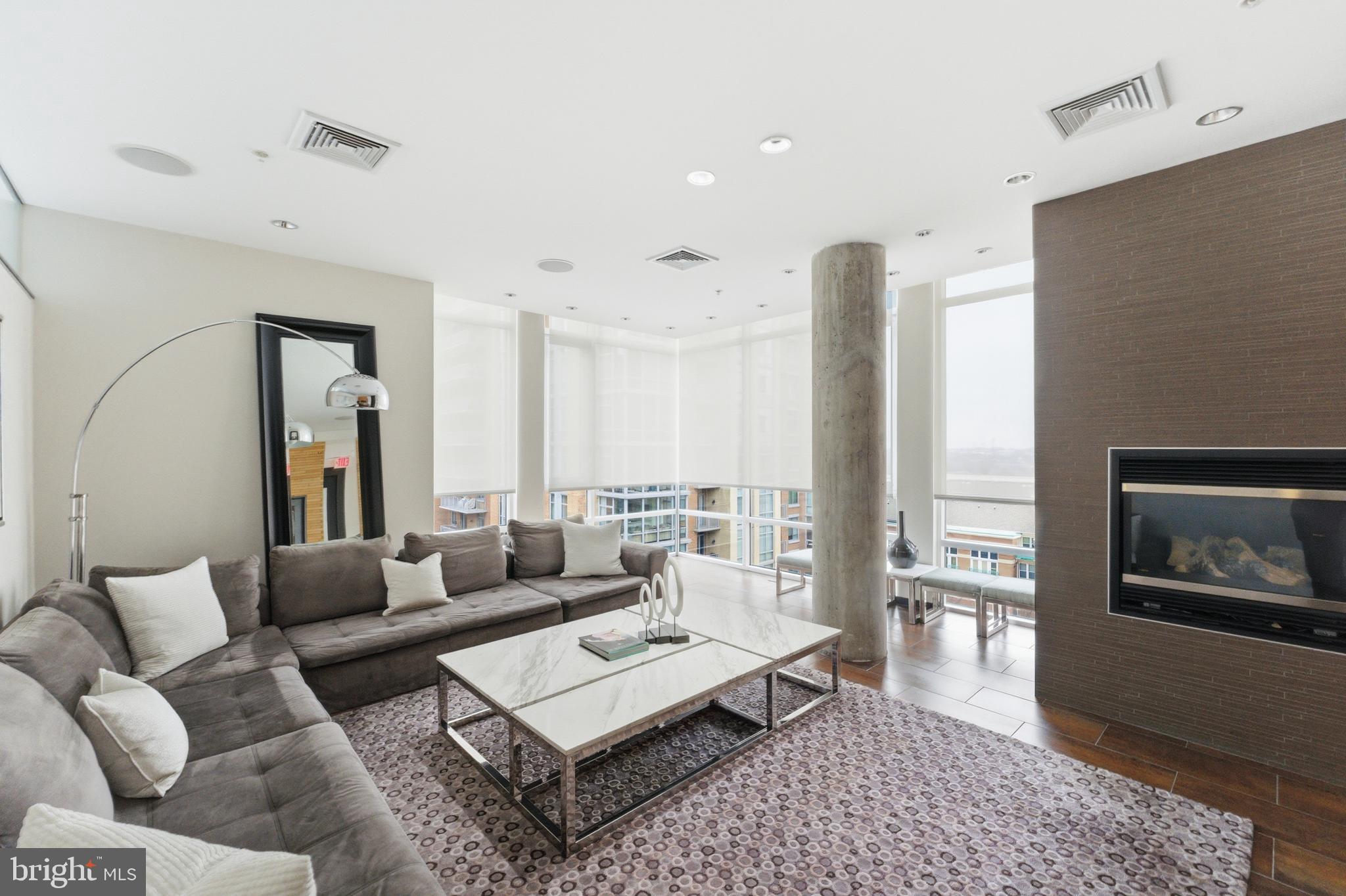 12025 New Dominion Parkway, Unit 103 Reston, VA 20190 - Photo 44 of 47 a living room with furniture and wooden floor