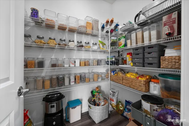 a room with lots of clutter and cabinets