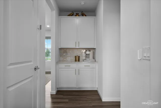a room with a sink and cabinets