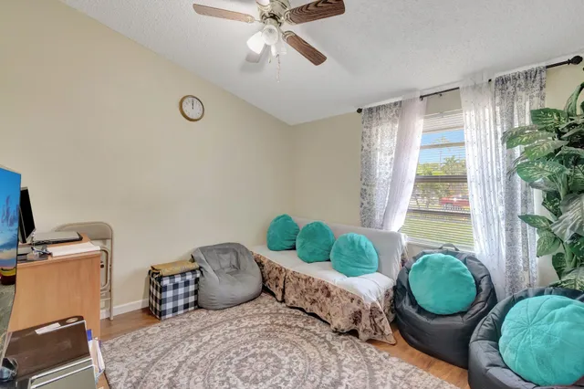 a bedroom with bed and a window