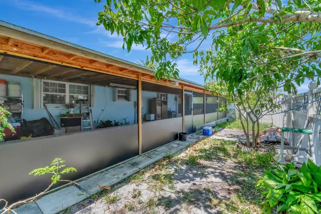 a view of backyard with patio