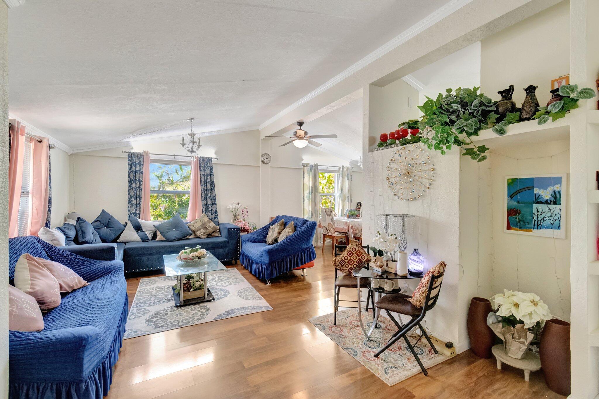 3935 Chickasha Road Atlantis, FL 33462 - Photo 9 of 44 a living room with furniture fireplace and a window
