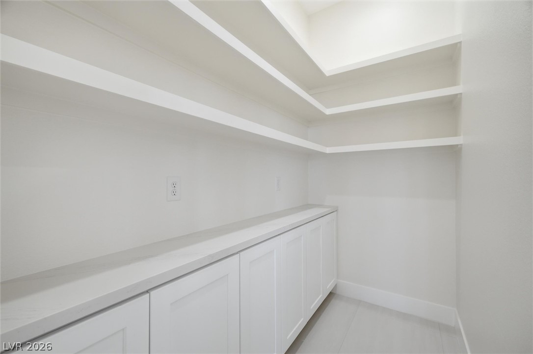 5910 East Kellogg Road Pahrump, NV 89061 - Photo 22 of 58 Functional pantry space features ample shelving and built-in storage solutions.