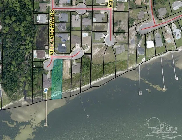 a view of a brick house with a bench next to a road