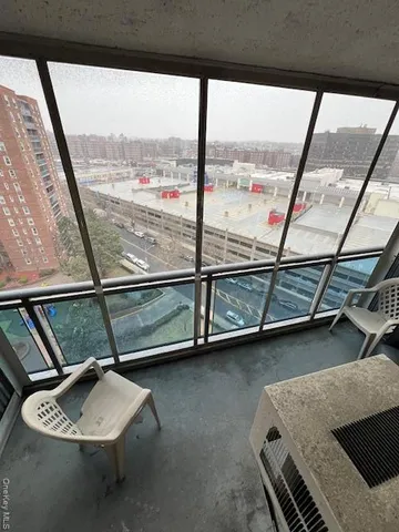 a view of an empty room with a floor to ceiling window