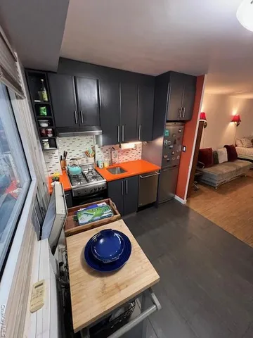 a room with furniture and gym equipment