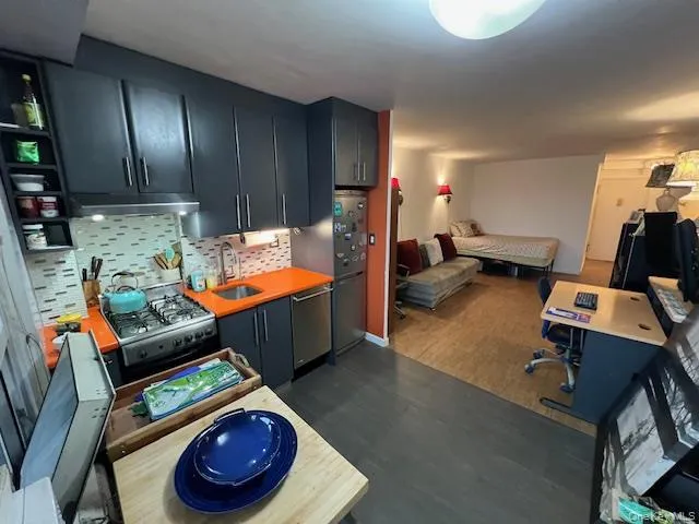 a room with furniture and gym equipment