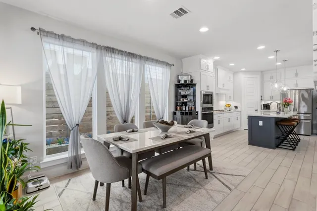 a view of a dining room kitchen and furniture