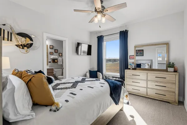 a view of a livingroom with furniture and a potted plant